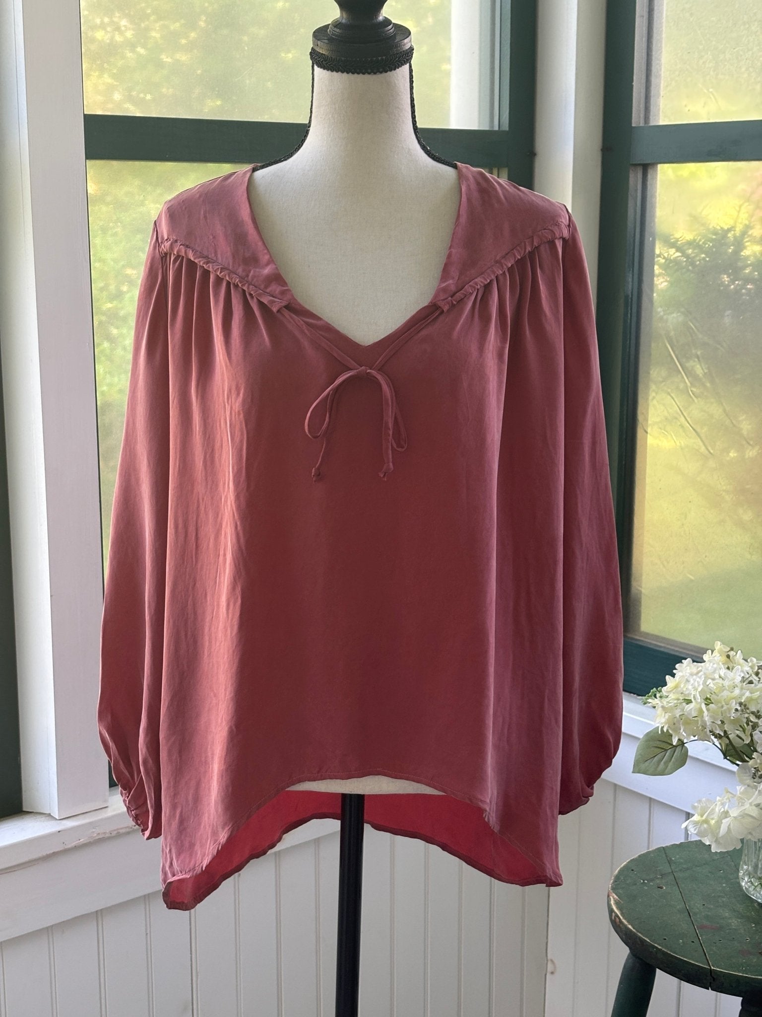 Young Fabulous & Broke dusty rose peasant blouse, front view on mannequin showing V-neck and tie detail