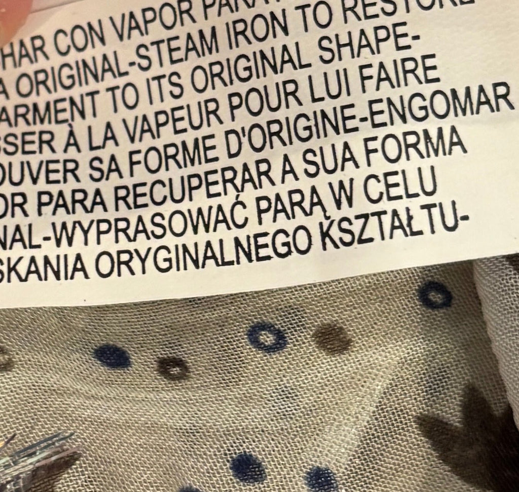 Care label showing steam iron instructions on Zara boho blouse
