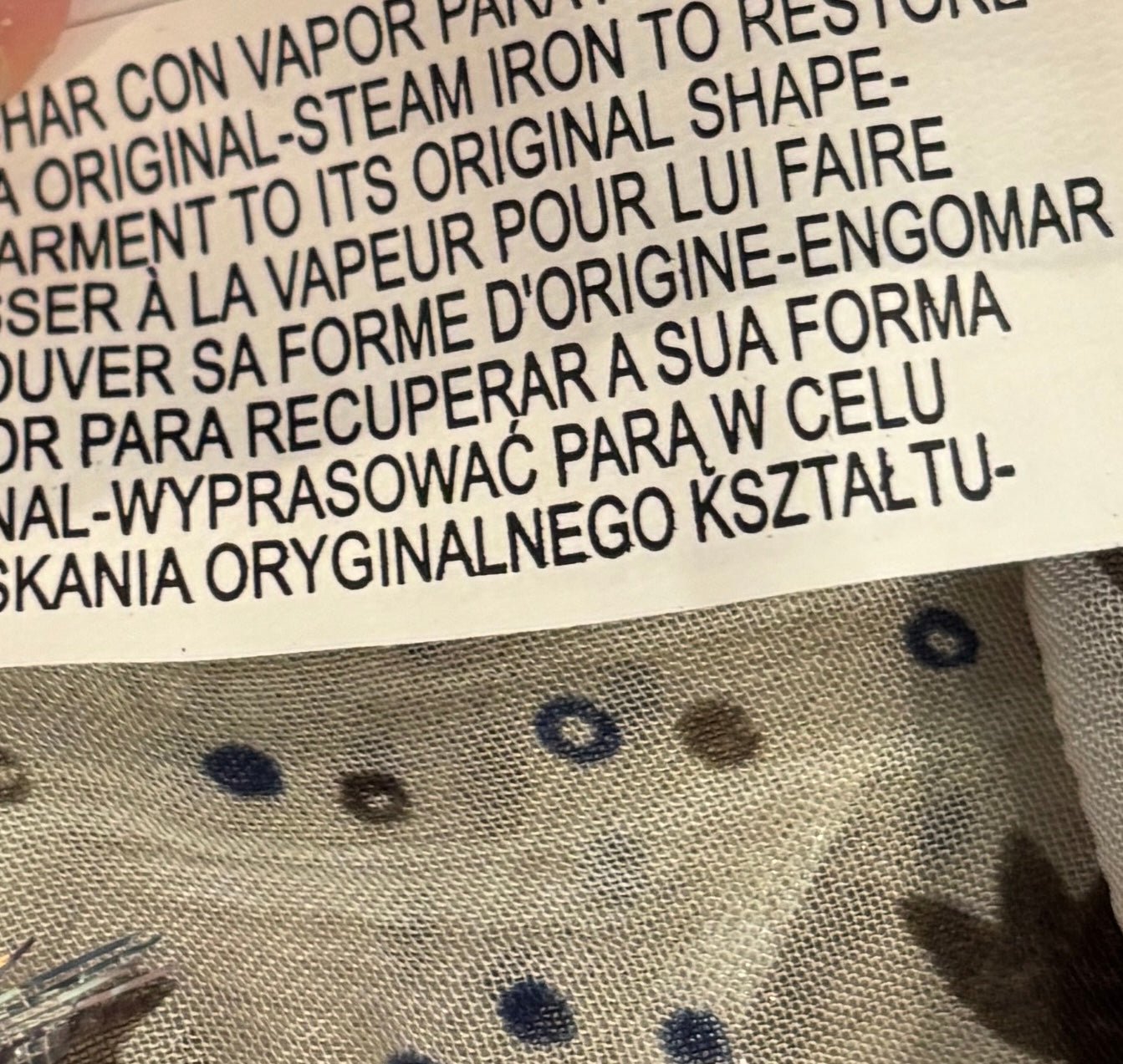 Care label showing steam iron instructions on Zara boho blouse