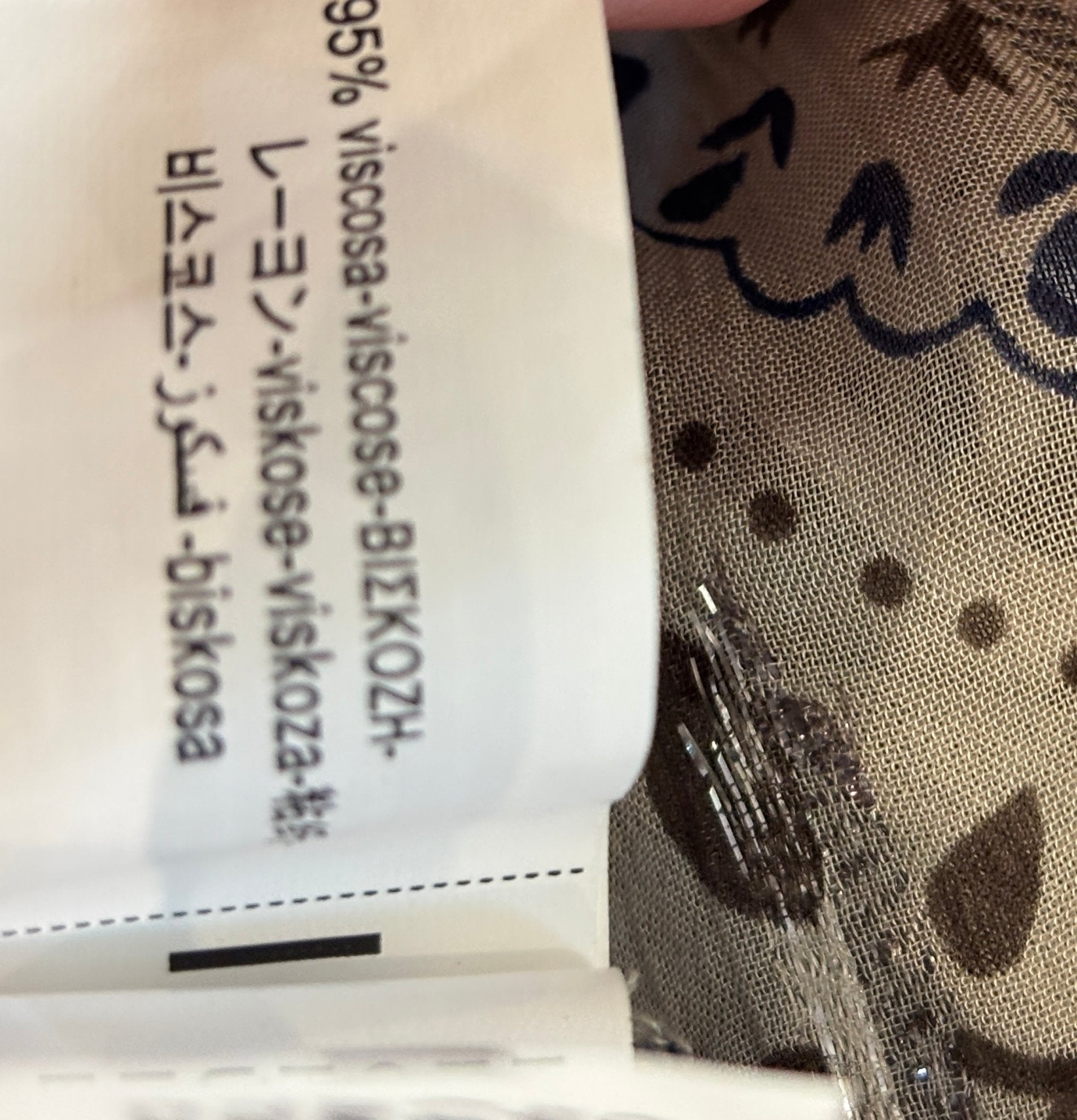 Fabric content label showing 95% viscose on Zara blouse