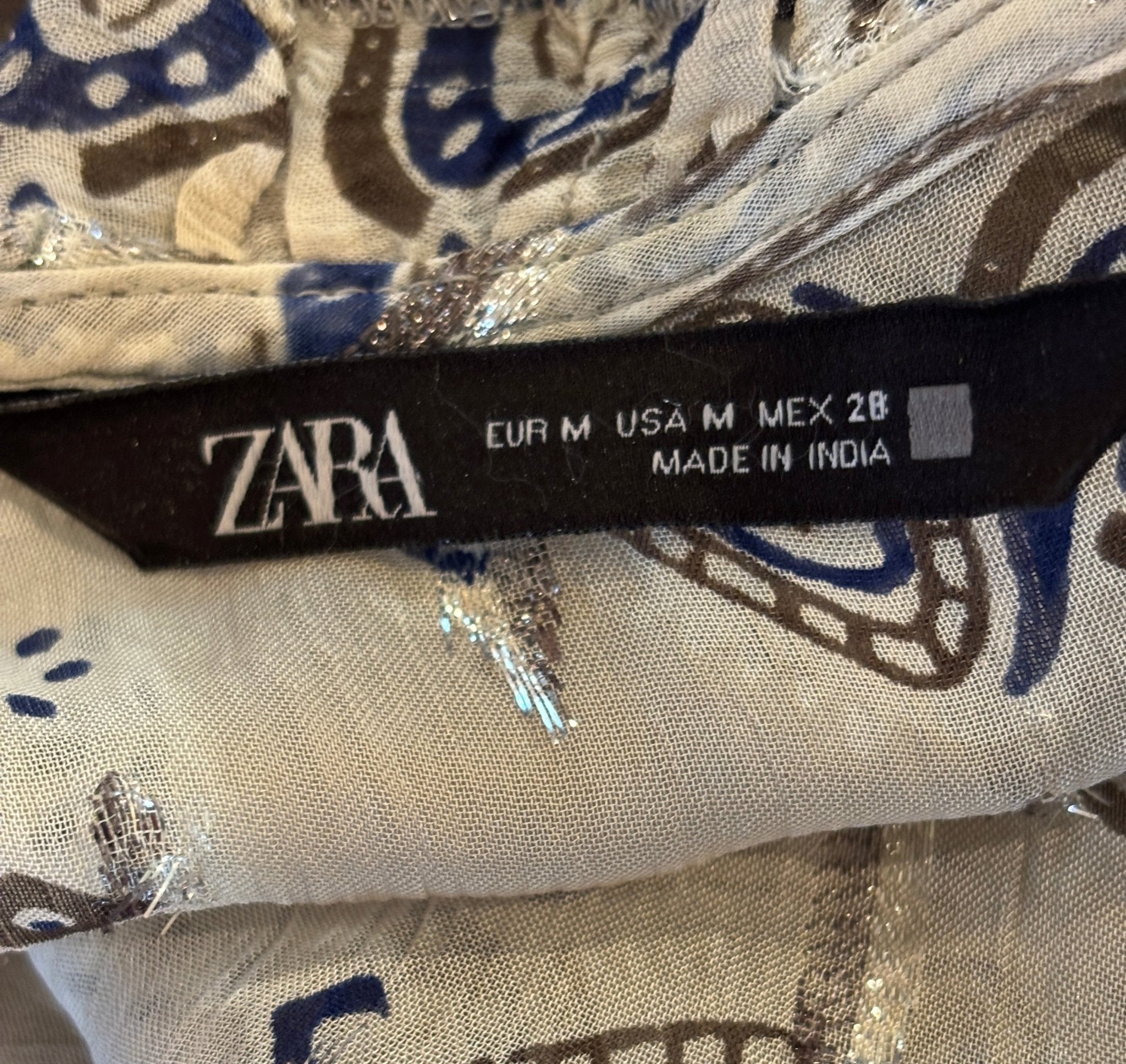 Zara brand label showing EUR M, USA M, MEX 28, made in India